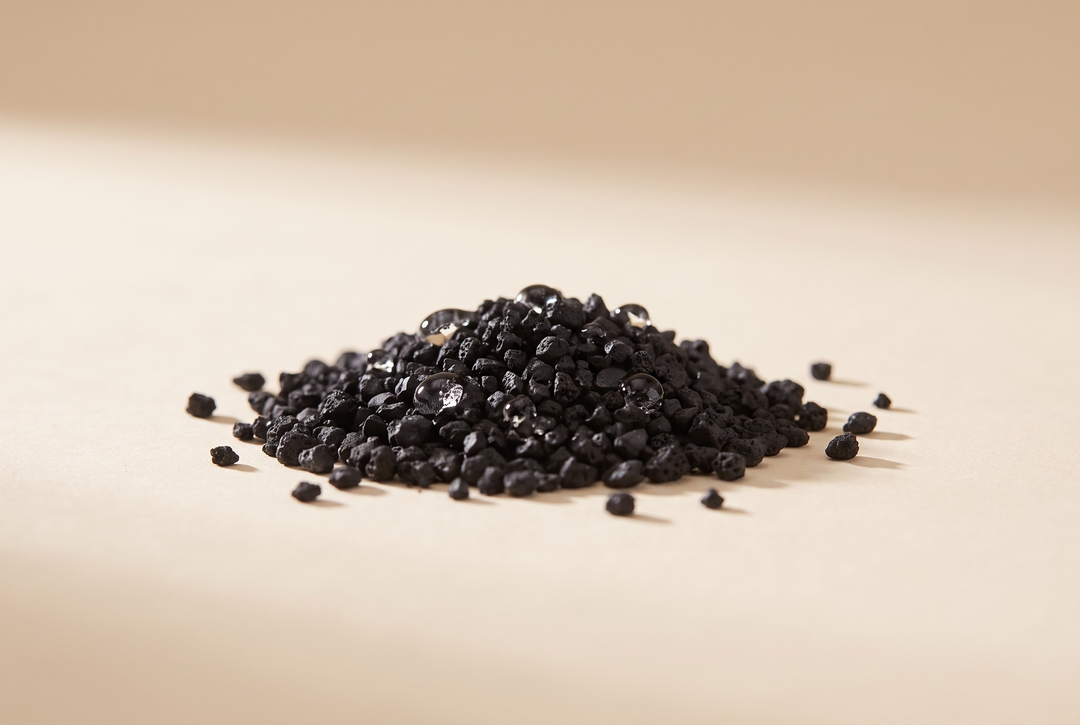 Granular activated carbon on a warm studio surface